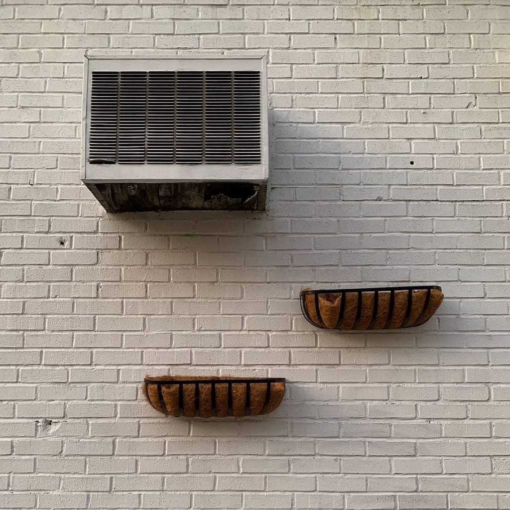 gray and black wall mounted shelf