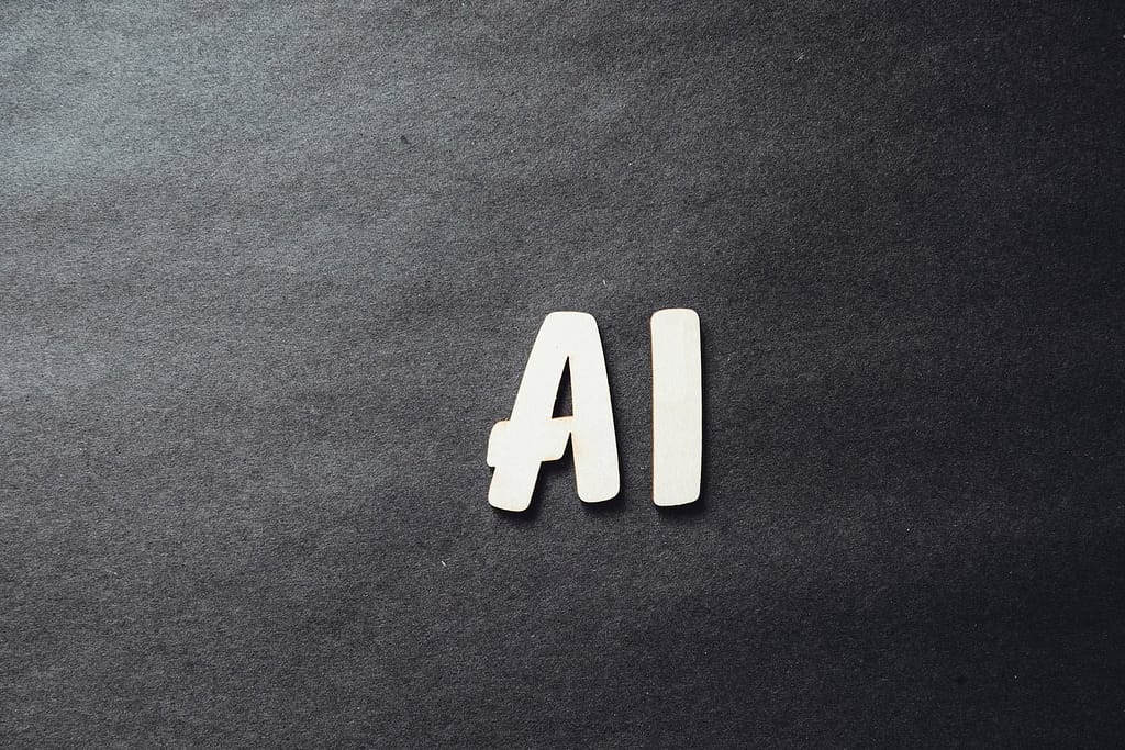 the word ai spelled in wO impacto das novas tecnologias, como o ChatGPT, nos sites imobiliários